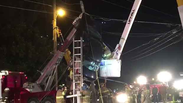 Driver Rescued From Car Found Hanging From Power Lines!
